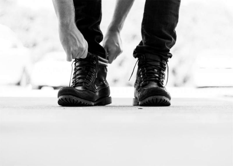 Black leather lace-up boot